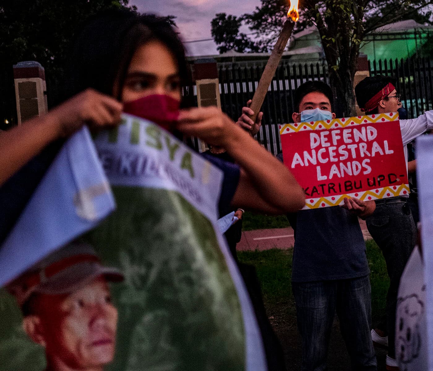 MANILA, PHILIPPINES - NOVEMBER 10: Activists hold up torches and portraits of slain indigenous ...