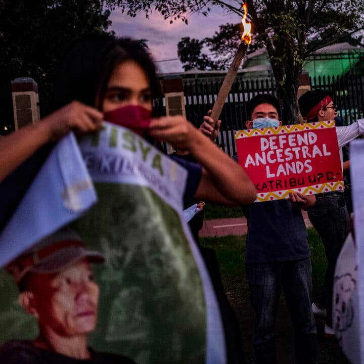 MANILA, PHILIPPINES - NOVEMBER 10: Activists hold up torches and portraits of slain indigenous ...